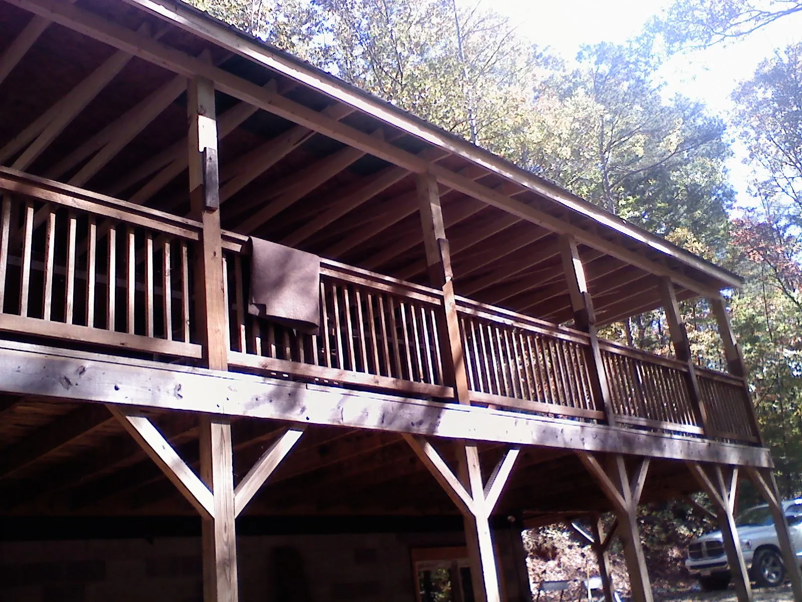 Timber framing under a new elevated porch and deck — Roof Leak Repair in Peterboro by Roofing Brothers
